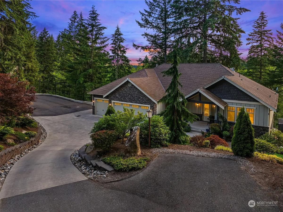 Craftsman Elegance Nestled Among Towering Pines with a Three-Car Garage