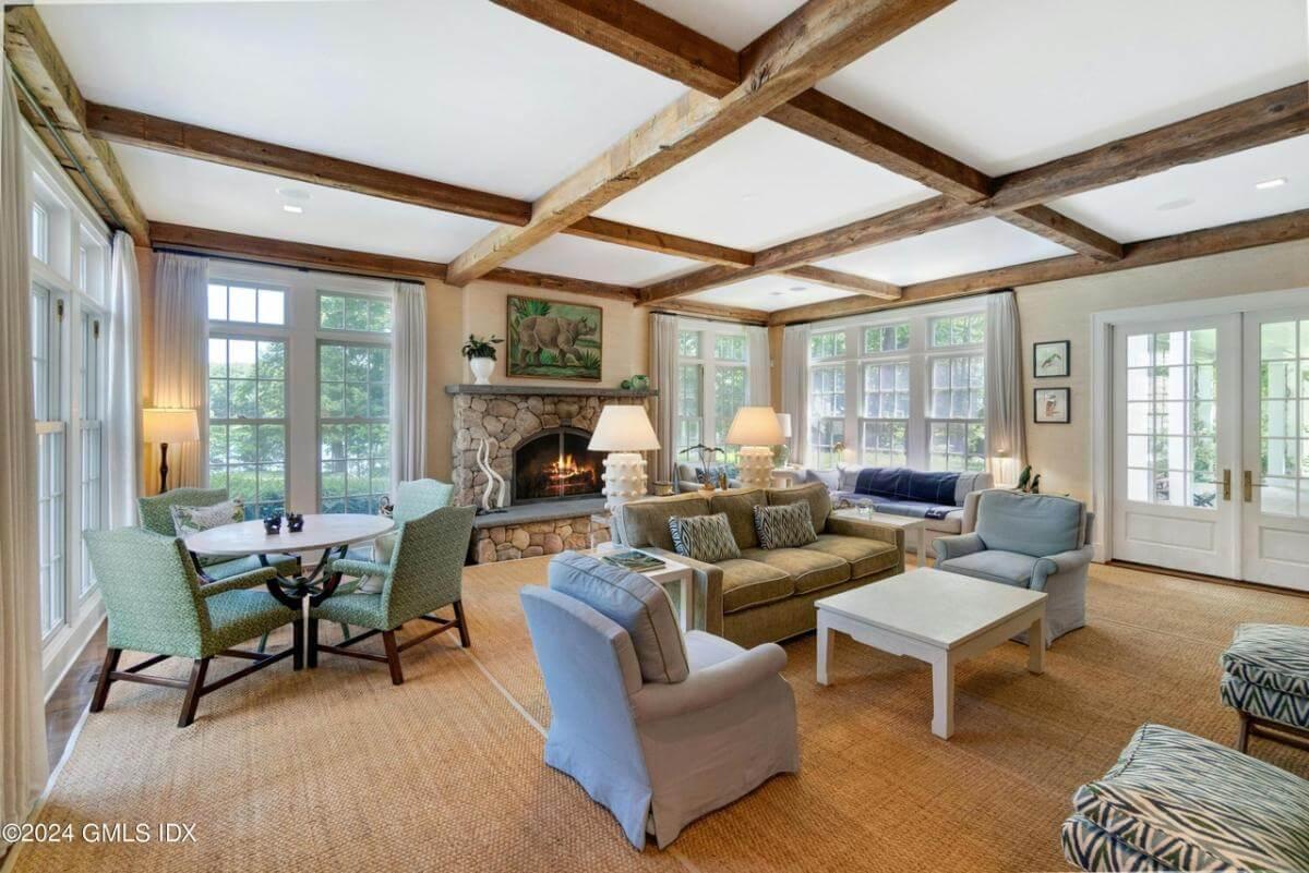 Relax in This Warm Family Room Highlighted by Exposed Beams