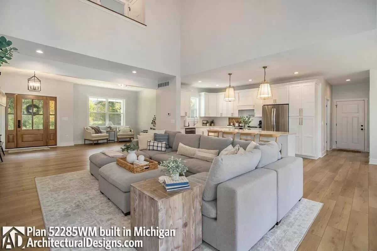 Open-Concept Living Room with Light Wood Floors and Inviting Kitchen