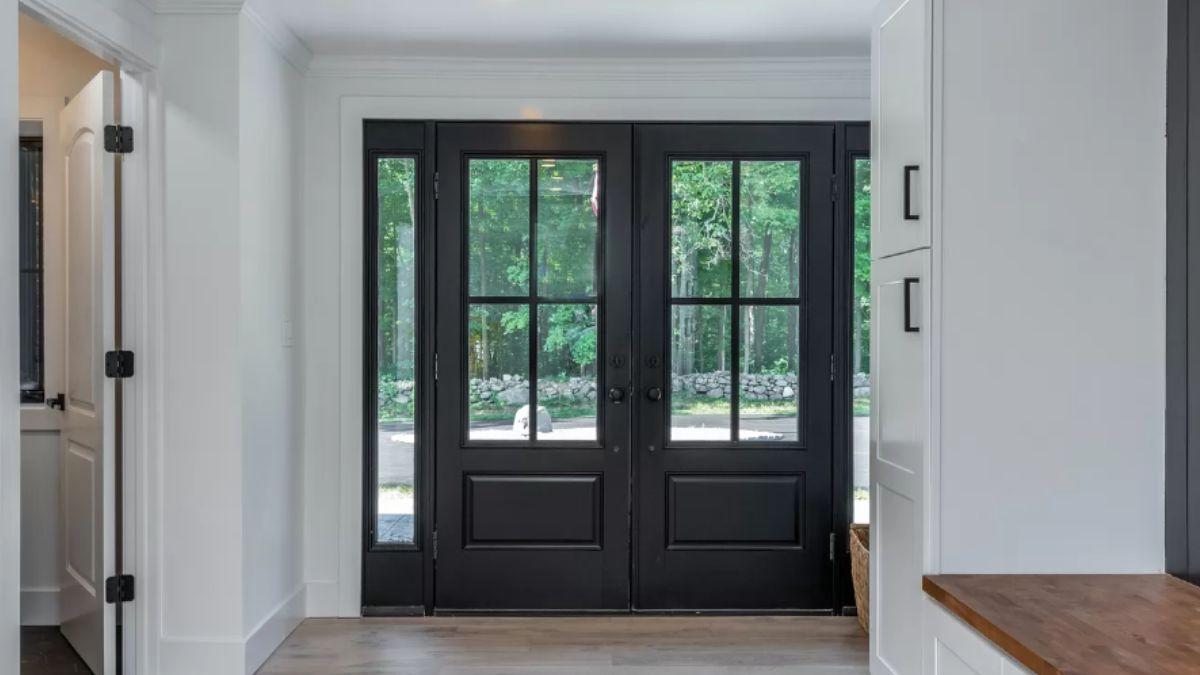 Sleek Entryway with Bold Black French Doors