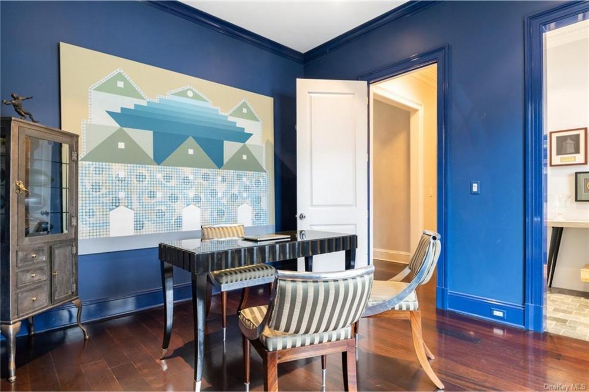Bold Blue Home Office with Geometric Art