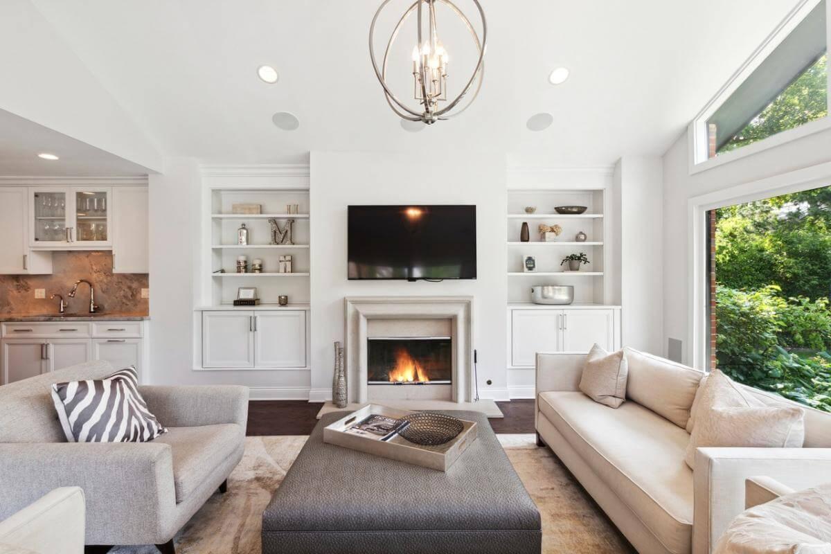 Living Room with Built-In Display Shelves and a Cozy Fireplace