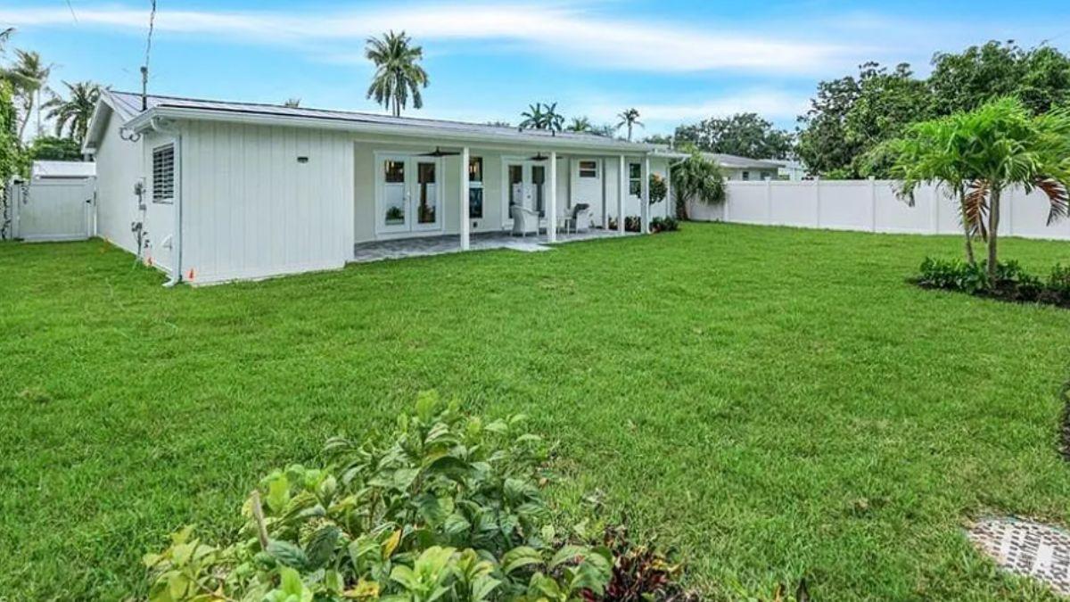Relax on the Covered Patio Overlooking a Lush Lawn