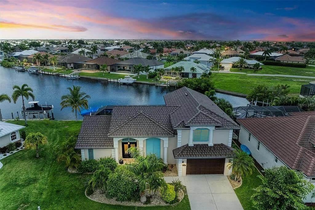 Waterfront Retreat with Classic Tile Roofing and Lush Landscaping