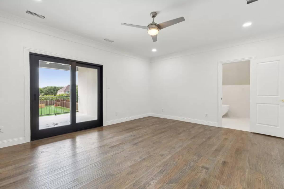 Simple Bedroom Style with Sleek Sliding Doors Leading to a Balcony