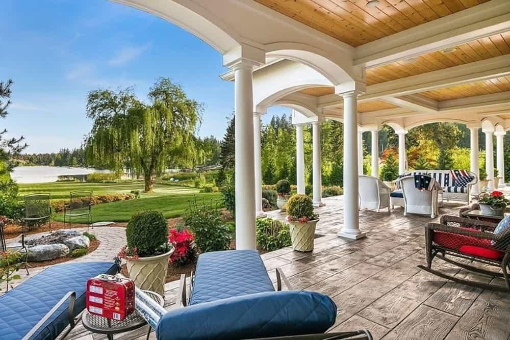 Take in the Scenic Lake View from This Elegant Covered Patio