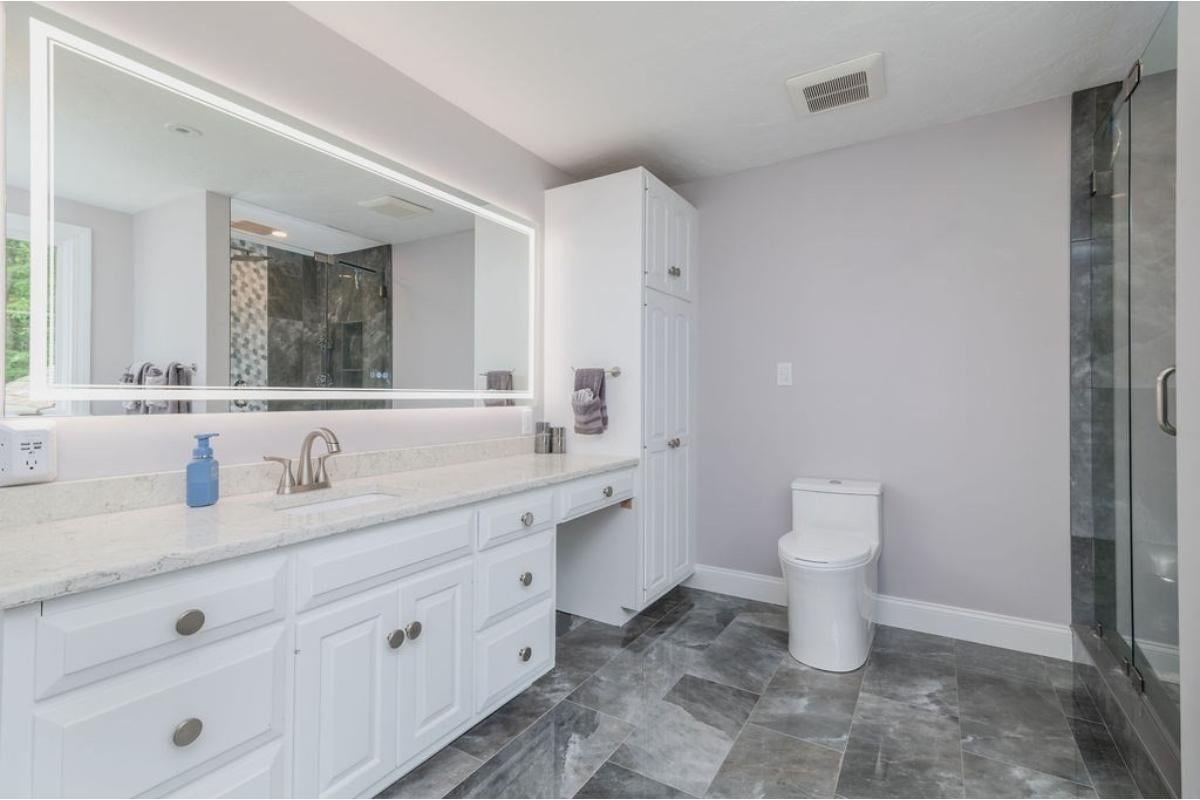 Sleek Bathroom Design with LED Mirror Lighting