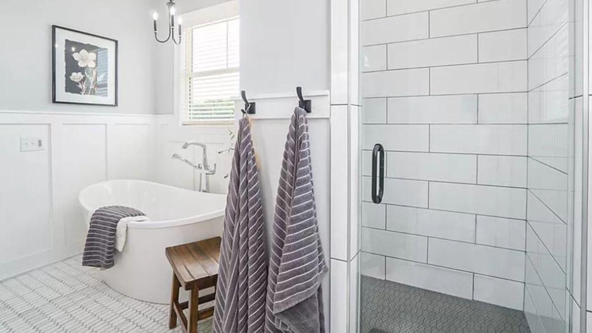 Stylish Bathroom Featuring a Freestanding Tub and Classic Details