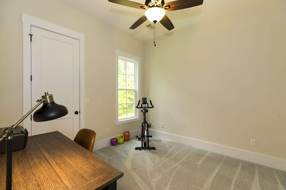 Versatile Craftsman Room Offering Office and Workout Space
