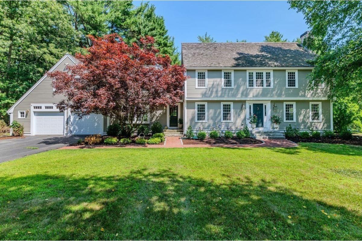Classic Colonial with Symmetrical Appeal and Red Brick Walkway