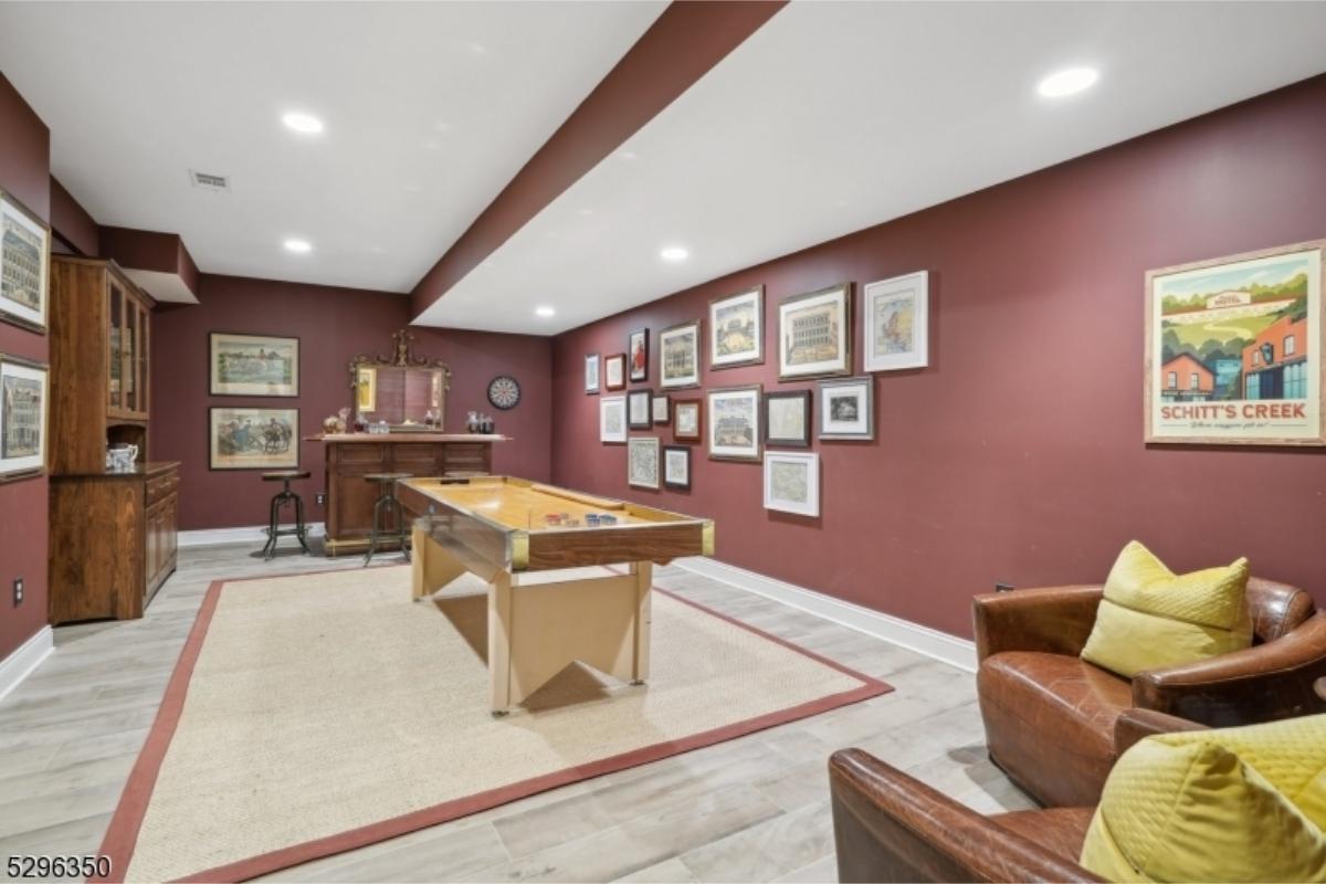 Step Into This Game Room with Rich Burgundy Walls and Vintage Accents