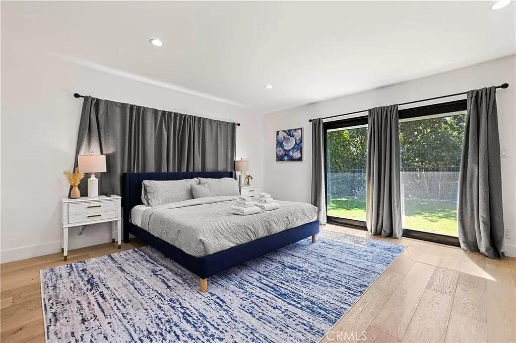 Serene Bedroom with Floor-to-Ceiling Windows Inviting Natural Light