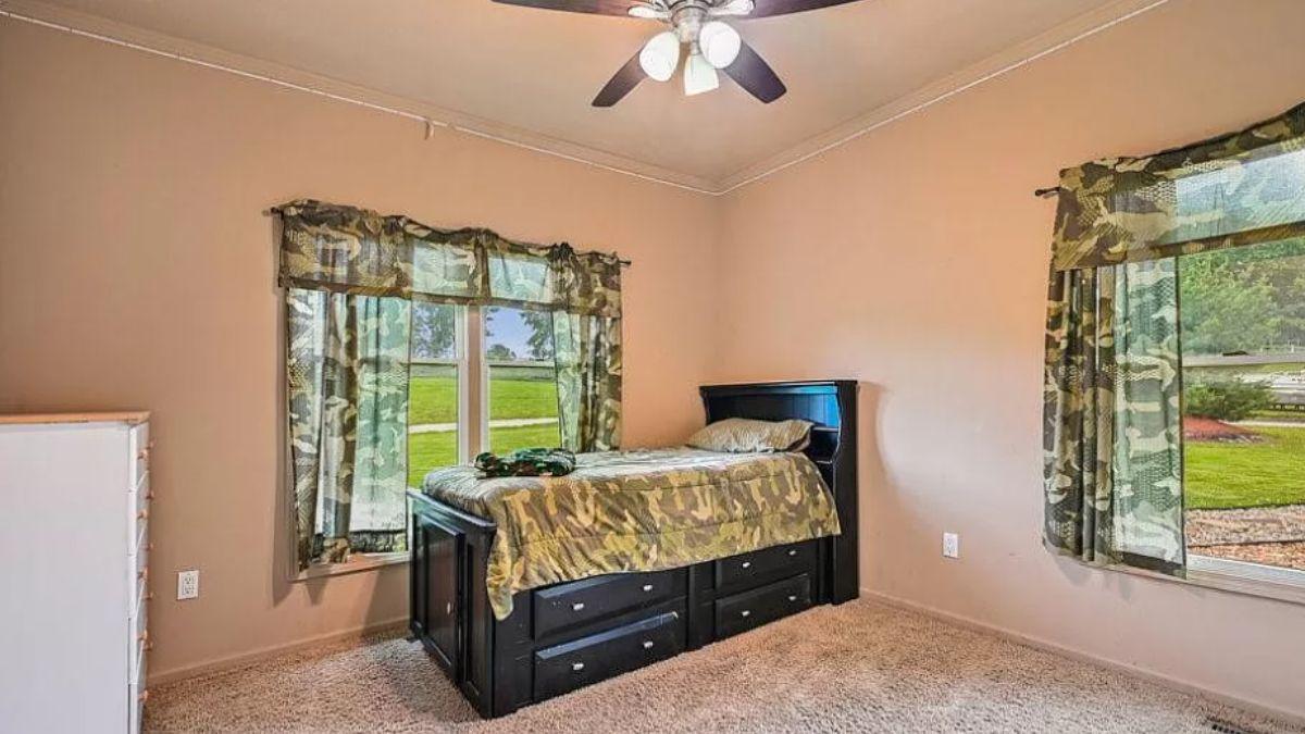 Bedroom with Camouflage Accents and Practical Storage Bed