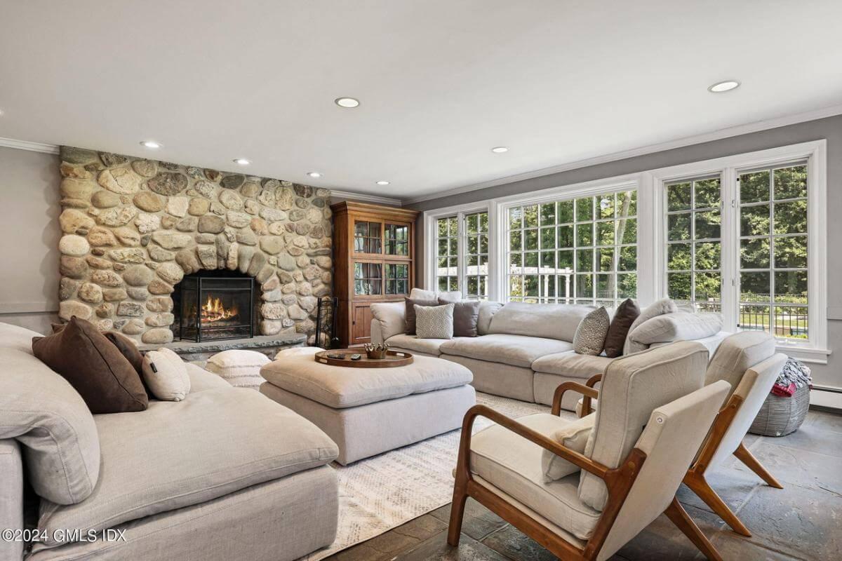 Cozy Living Room with a Stunning Stone Fireplace