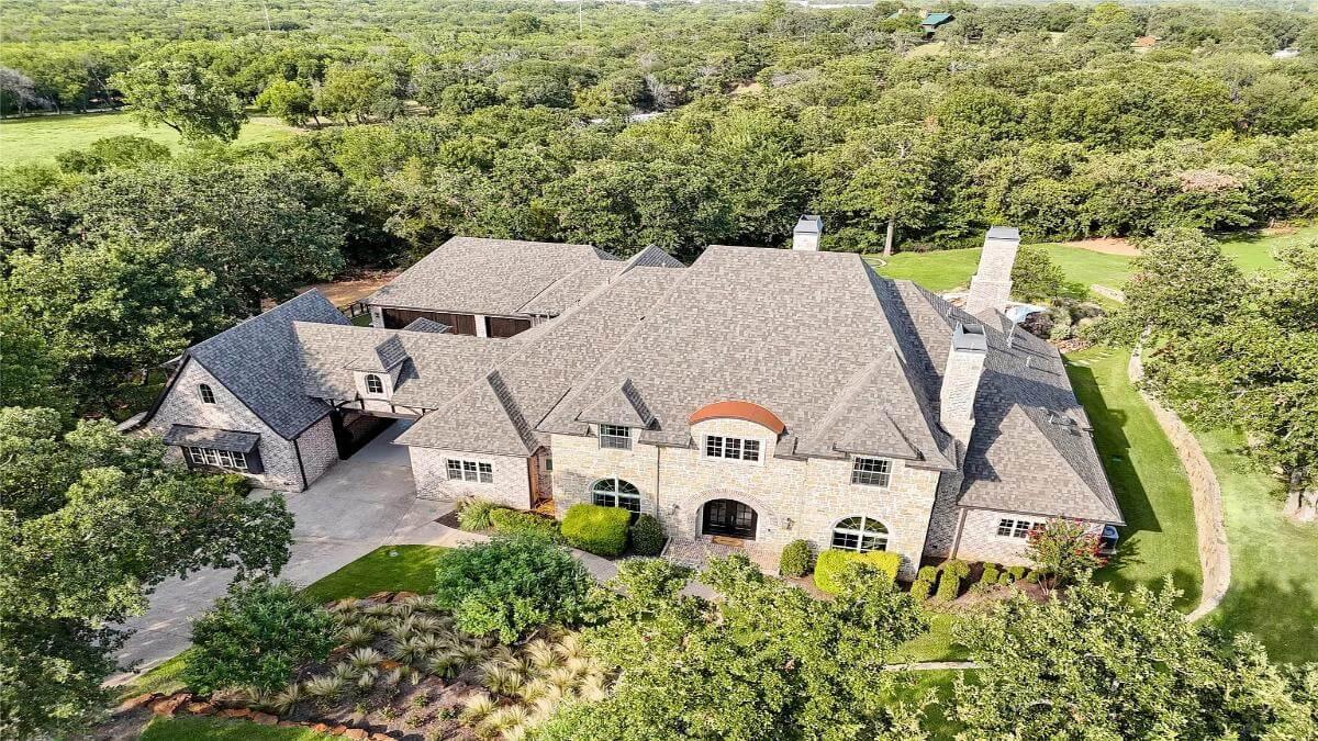 Stately Stone Estate Nestled Among Lush Greenery