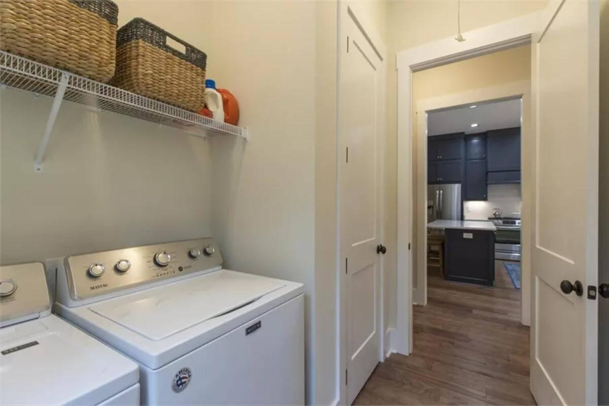 Simple Yet Efficient Laundry Room Leading to the Kitchen