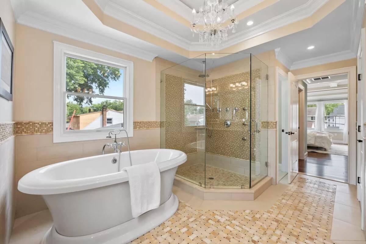 A Bathroom Retreat with a Luxurious Freestanding Tub and Crystal Chandelier