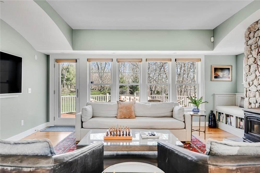 Relax by the Stone Hearth in This Sunlit Living Room