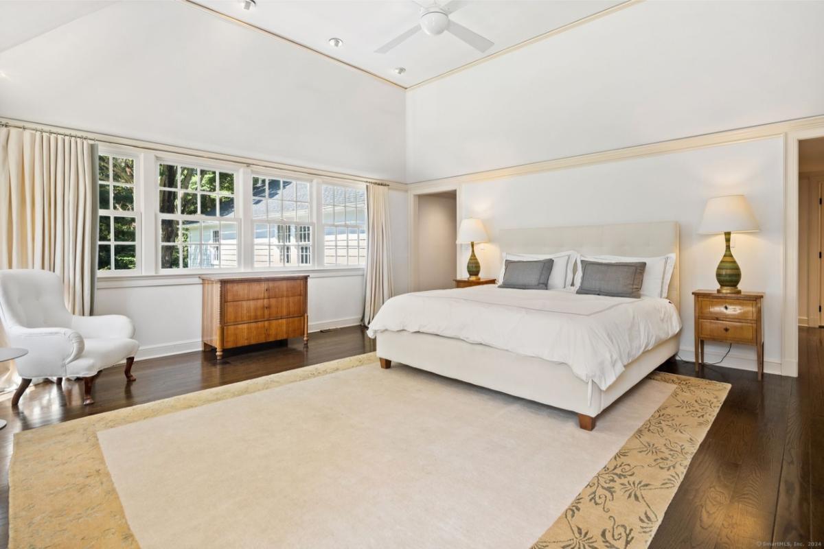 Spacious Bedroom with Vaulted Ceilings and Sunlit Windows