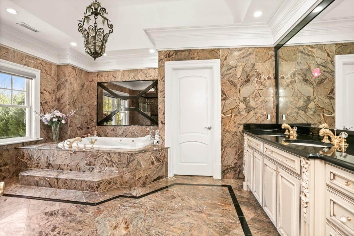 Luxurious Bathroom with Opulent Marble Design and Elegant Fixtures