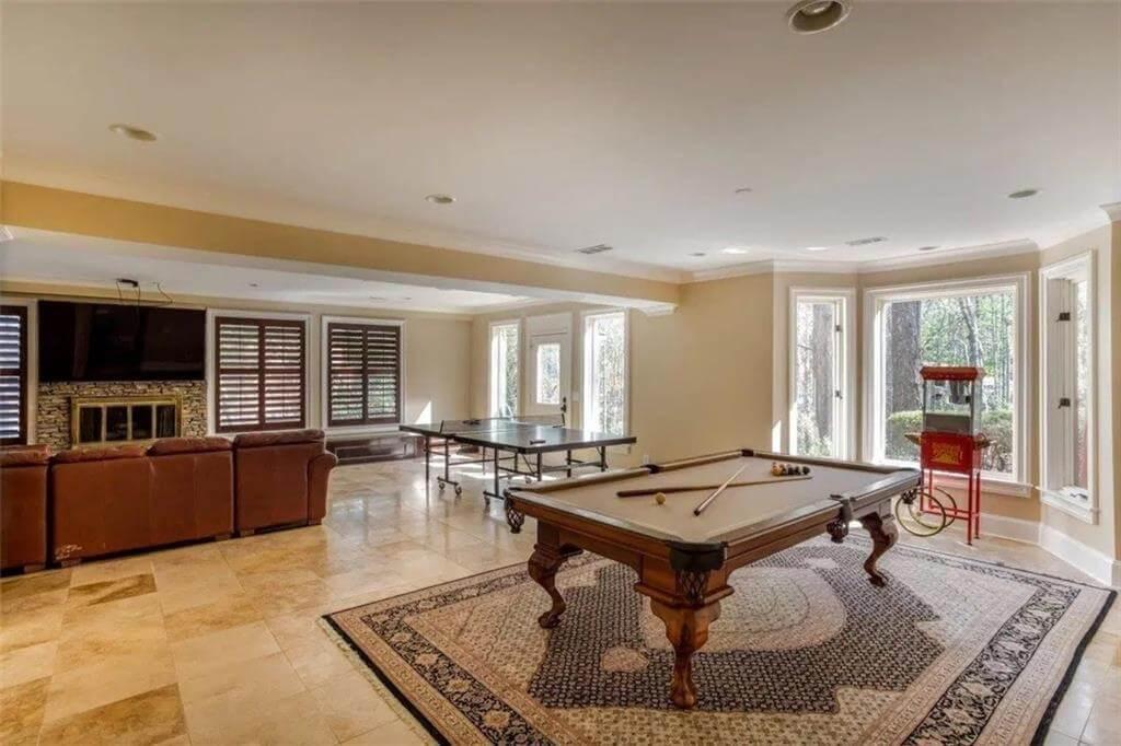 Check Out the Billiard Table and Fireplace in This Versatile Game Room