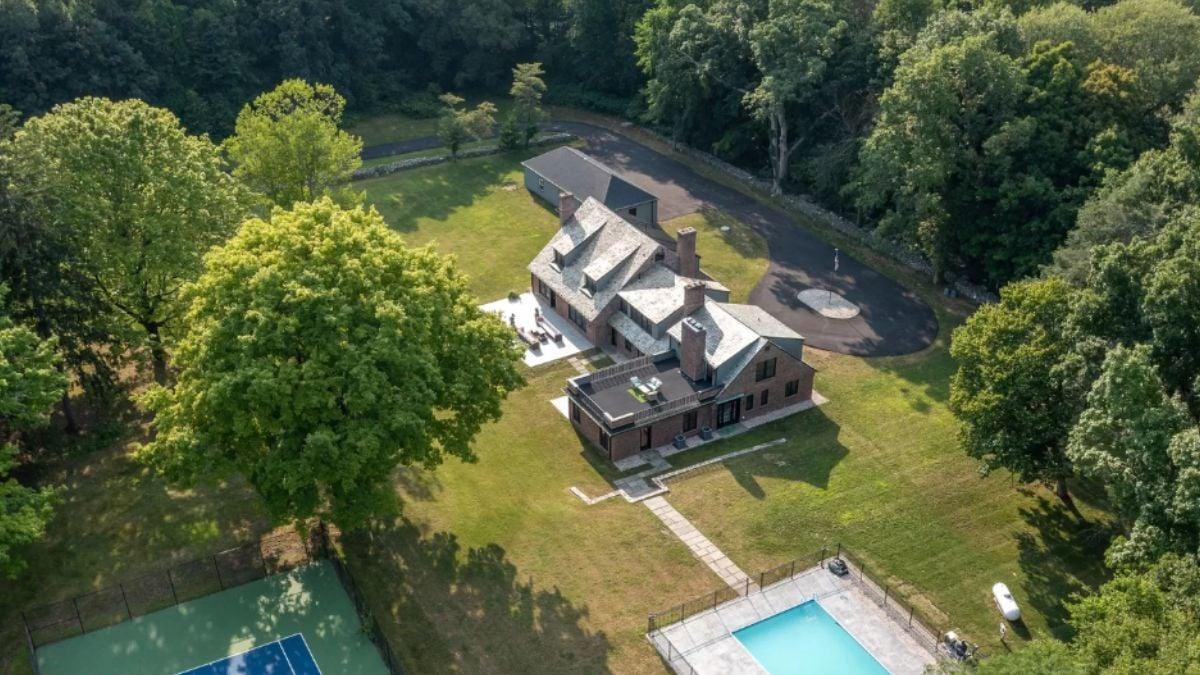Expansive Brick Estate with Pool and Tennis Court Nestled in Nature