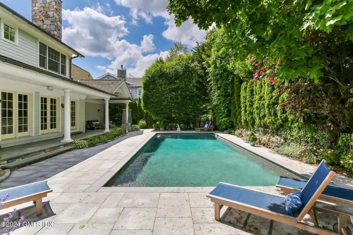 Take a Dip in This Inviting Pool Surrounded by Lush Greenery