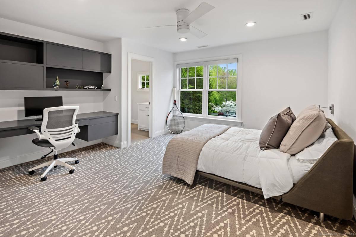 Sleek Home Office Setup in a Multi-Functional Bedroom Space
