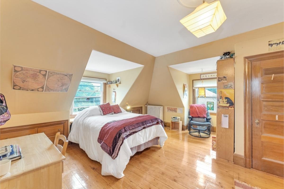 Quirky Bedroom with Alcove Seating and Warm Wood Tones
