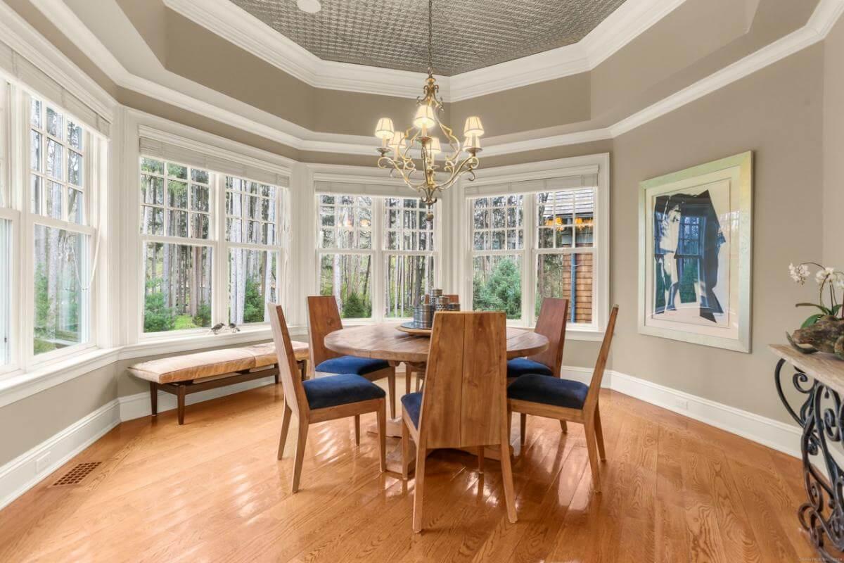 Charming Breakfast Nook with Floor-to-Ceiling Windows and Natural Views