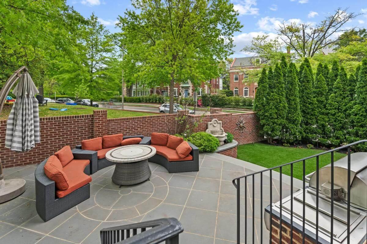 Gather Around in This Inviting Outdoor Space with a Circular Fire Pit