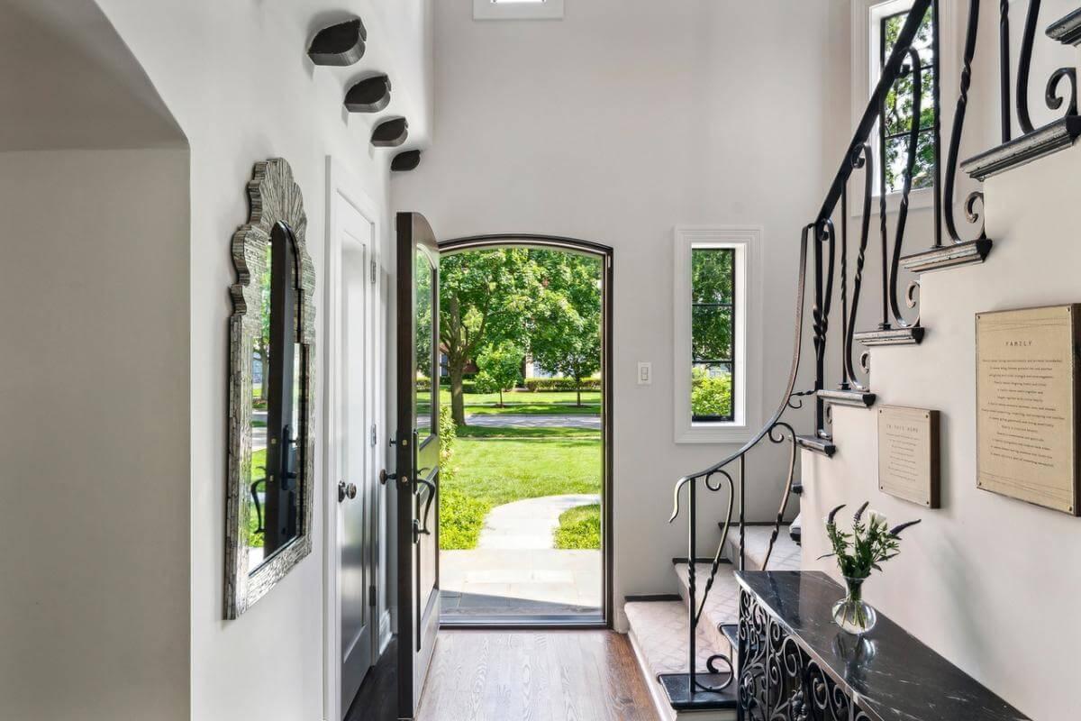 Welcome to a Charming Entryway with Wrought Iron Accents