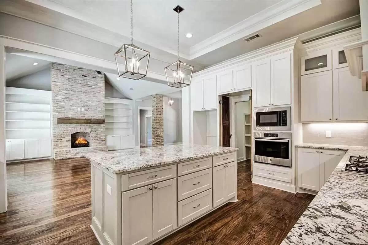 Explore the Granite Island and Open Shelving in This Elegant Space