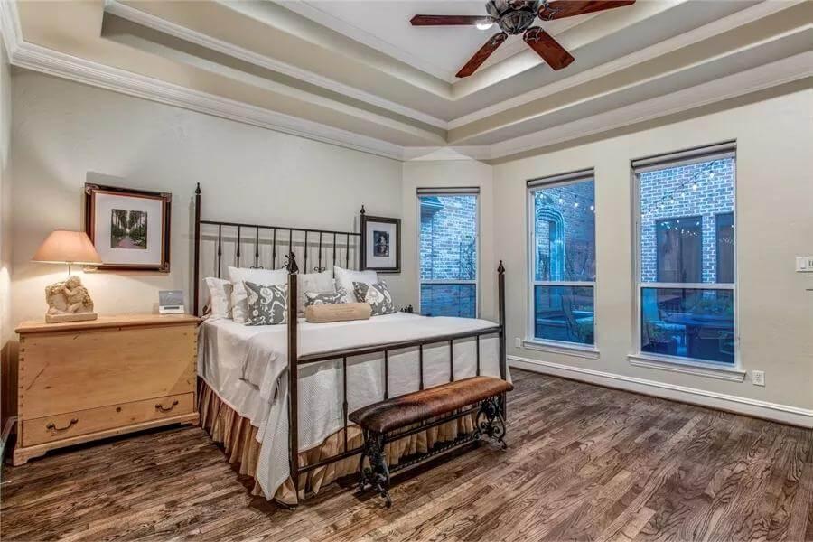 Step into This Spacious Bedroom with Tray Ceiling