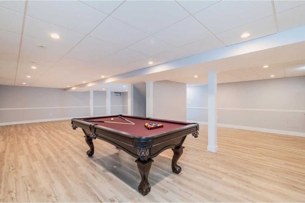 Basement Entertainment Area Featuring a Classic Pool Table