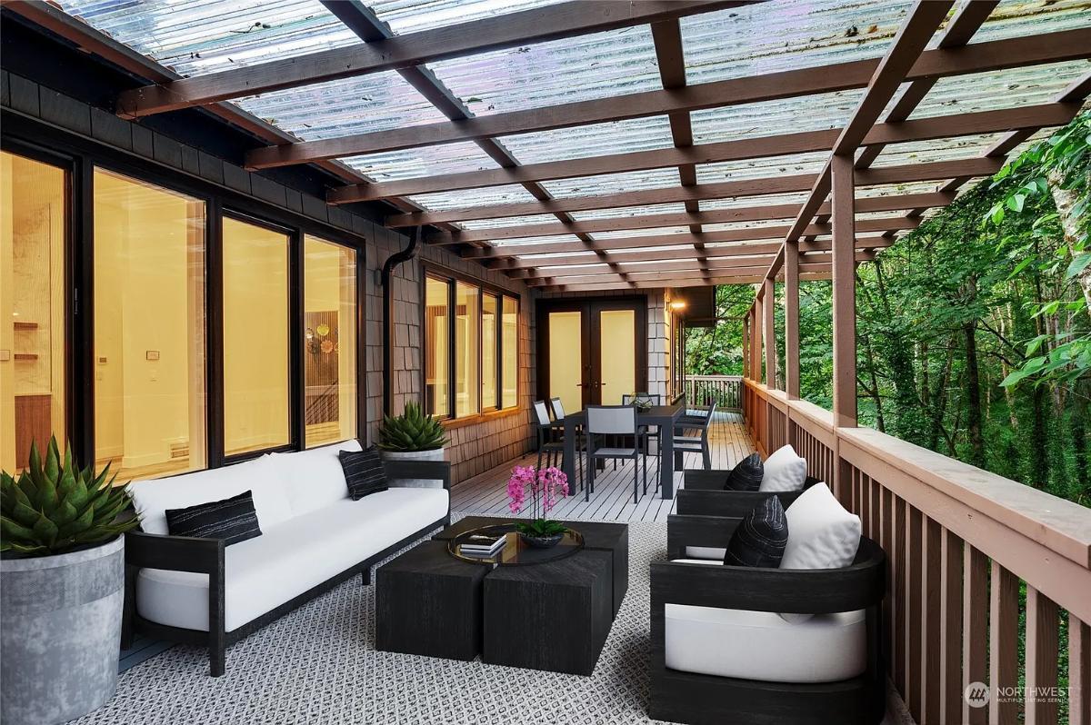 Relax Under the Transparent Pergola on This Inviting Porch