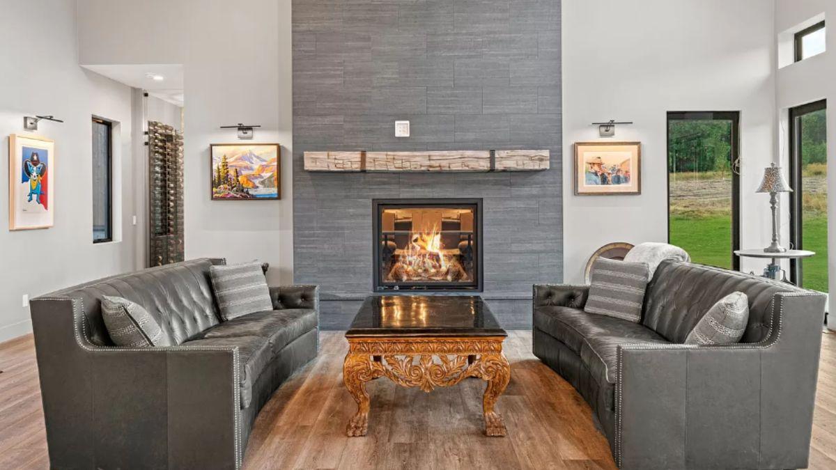 Check Out This Fireplace with Sleek Stone and Rustic Mantel