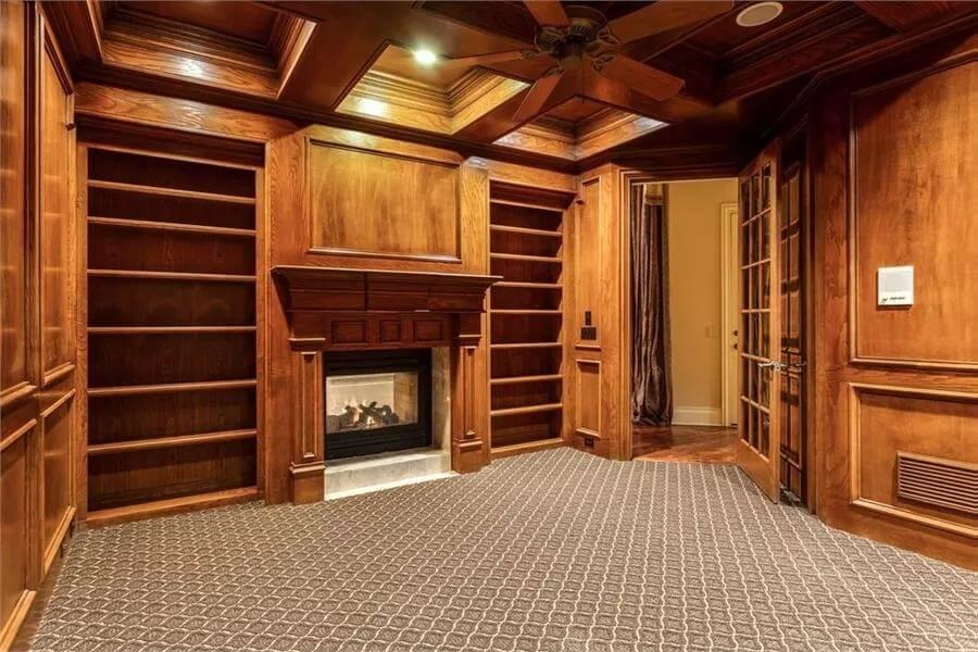 Marvel at the Rich Wooden Paneling in This Cozy Library Nook