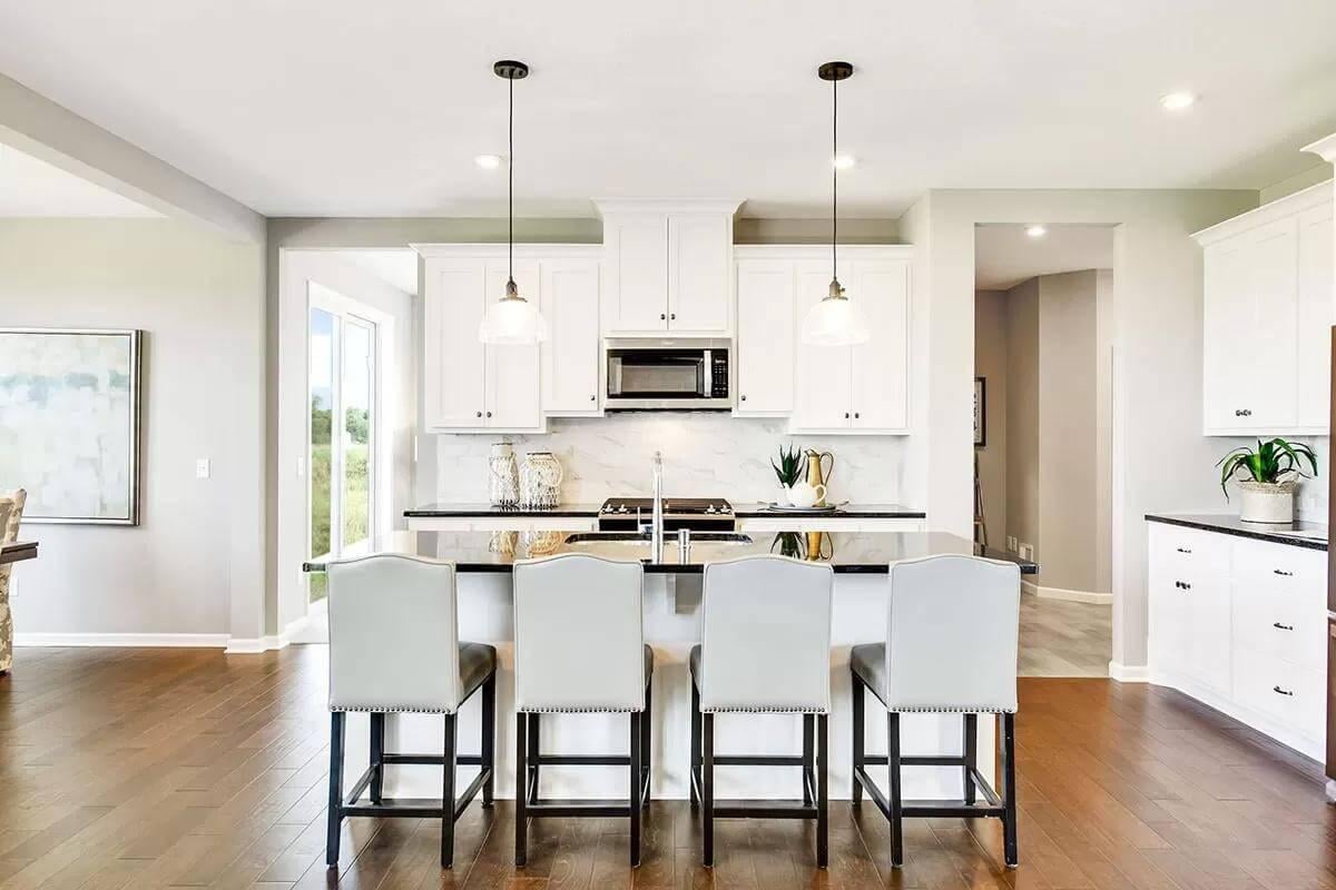 Sleek Kitchen with a Striking Island and Pendant Lighting
