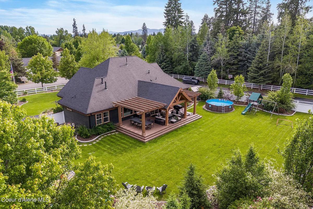 Wow, Check Out This Backyard with a Craftsman Pergola and Ample Green Space