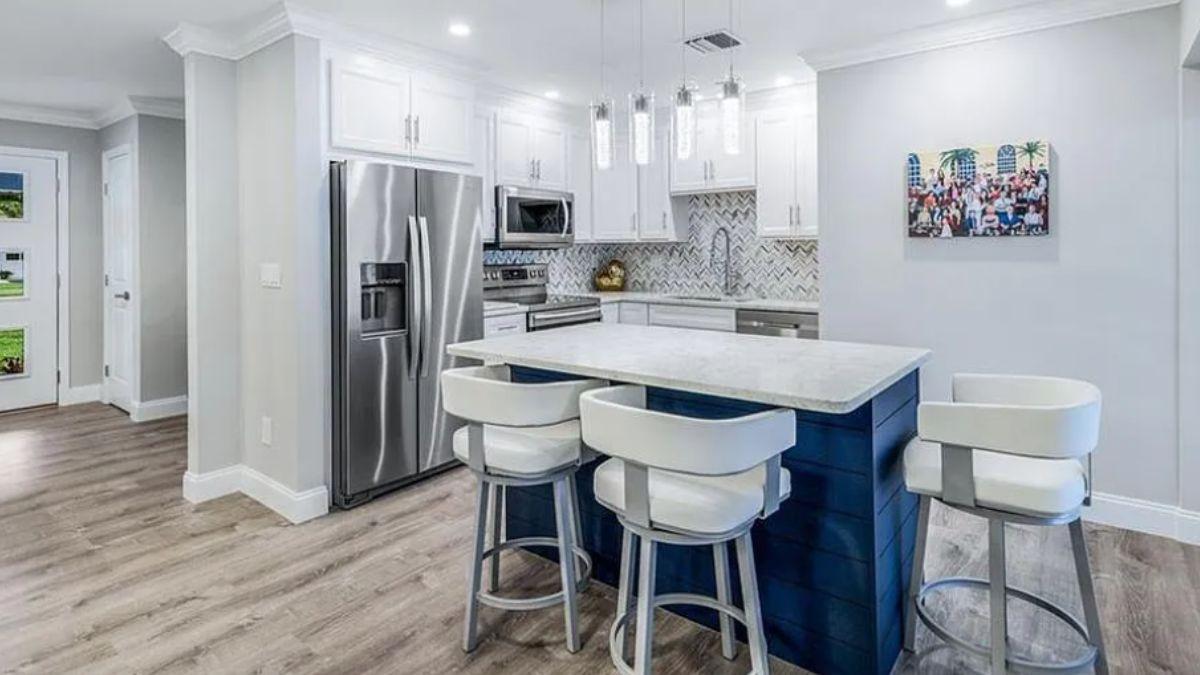 Dive into This Spacious Kitchen with a Bold Blue Island