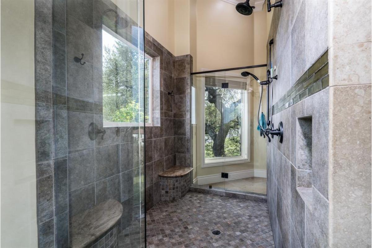 Walk-In Shower with Nature Views and Dual Benches