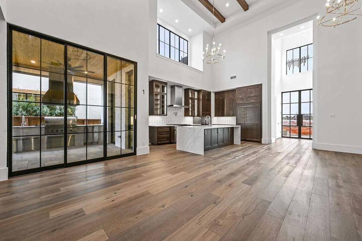 Marvel at the Expansive Glass Doors and Soaring Ceilings in This Bright Kitchen