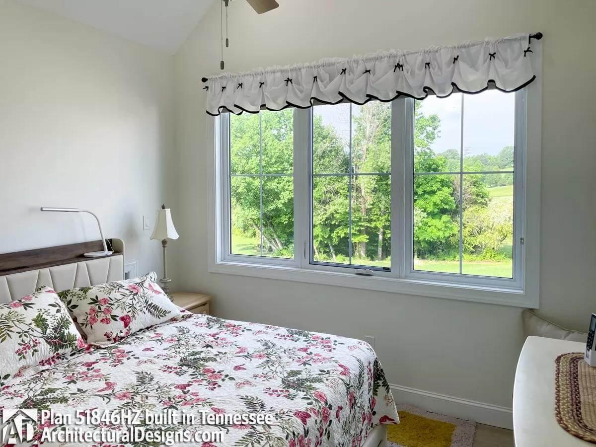 Serene Bedroom with Floral Accents and Scenic Views