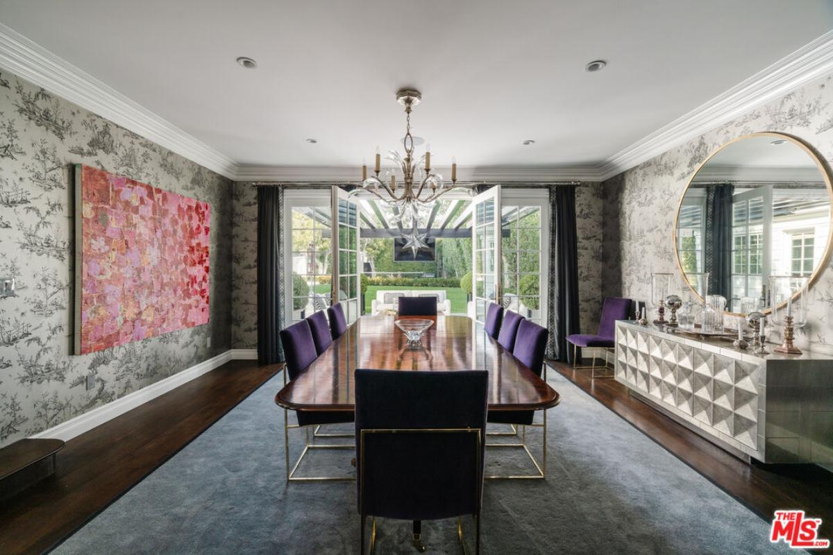 Elegant Dining Room with Statement Wallpaper and Vibrant Accents