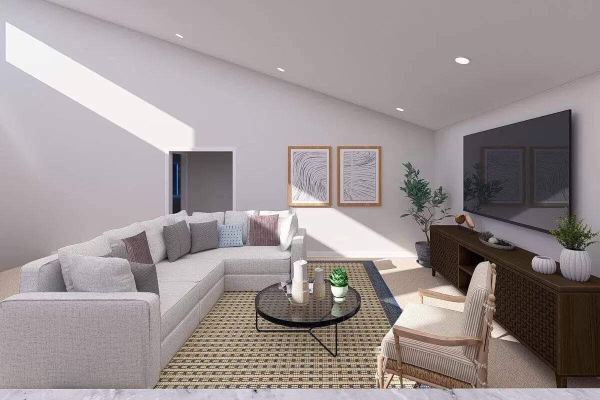 Relax in This Stylish Living Room with Lofted Ceiling and Skylight