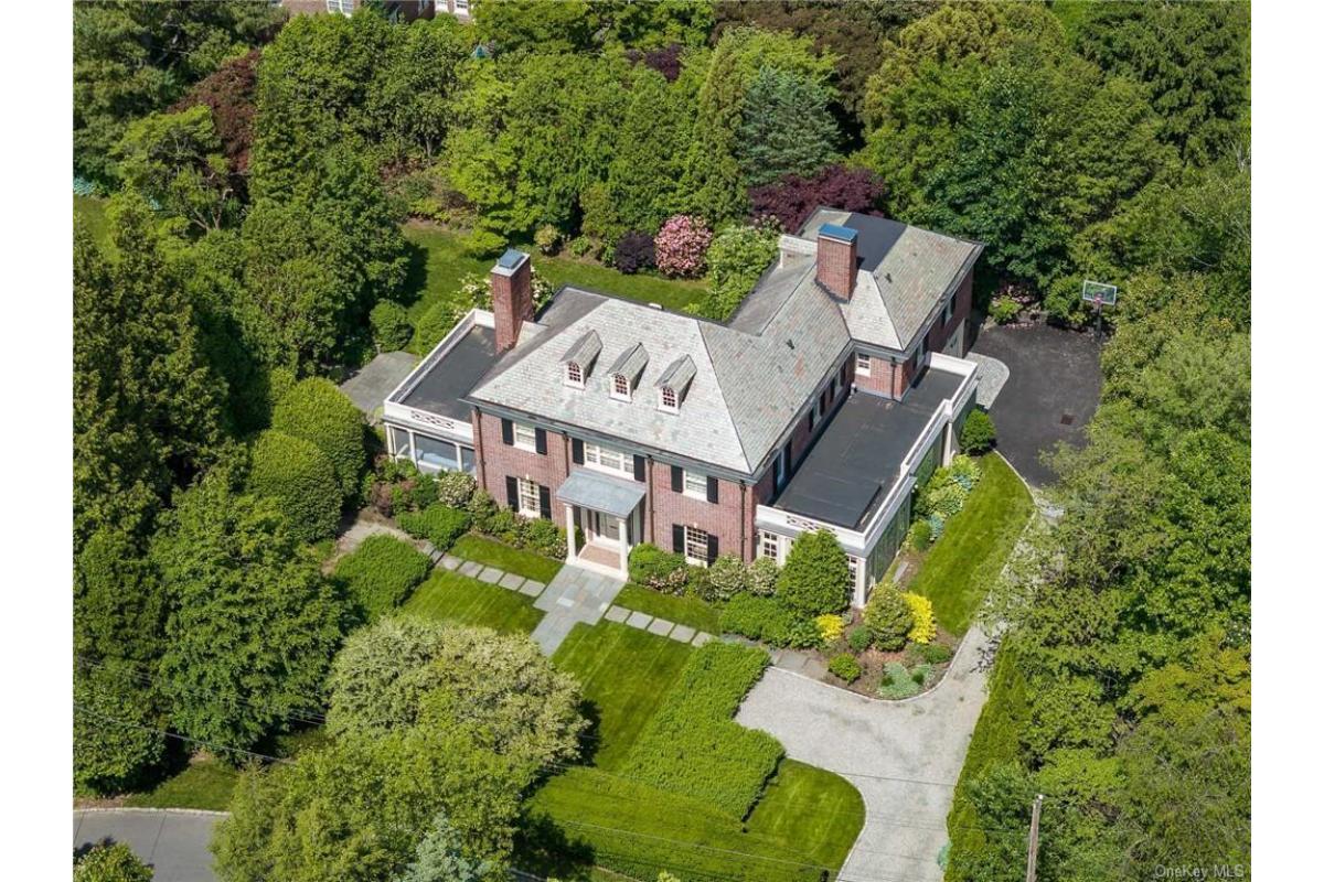 Stately Brick Estate Nestled in Lush Greenery