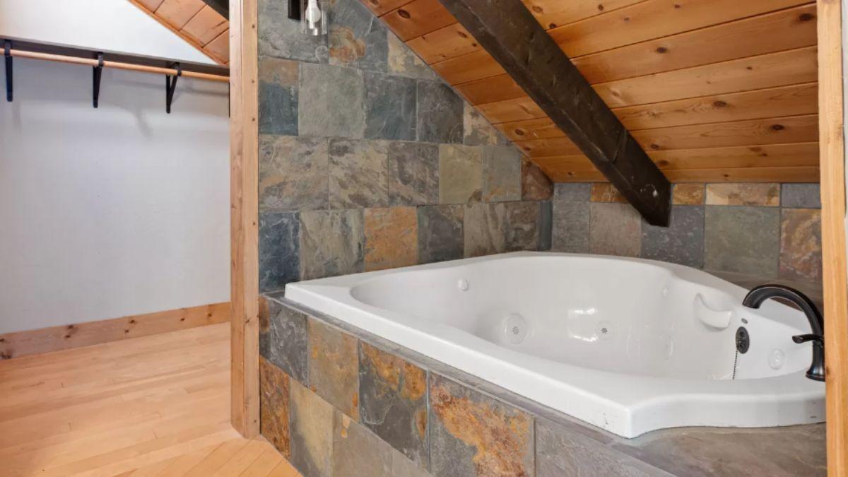 Relax in This Spa-Like Tub with Slate Surround