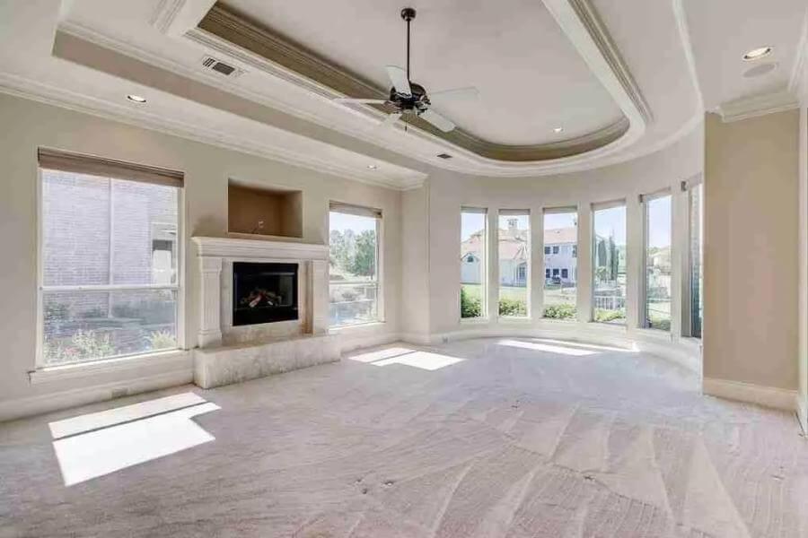 Take In the Expansive Bay Windows in This Elegant Living Room