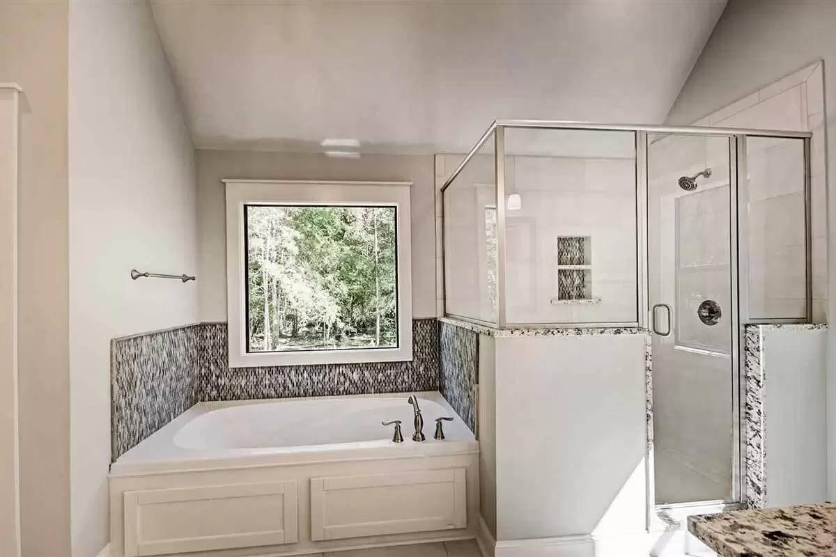 Experience the Luxury Around This Granite-Topped Tub and Shower Combo